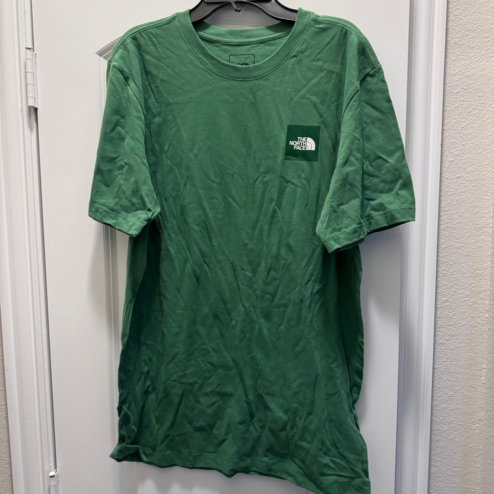 Men’s medium green North Face tee shirt.